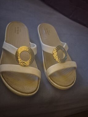 CROCS White Slide Sandals with Gold Medallion